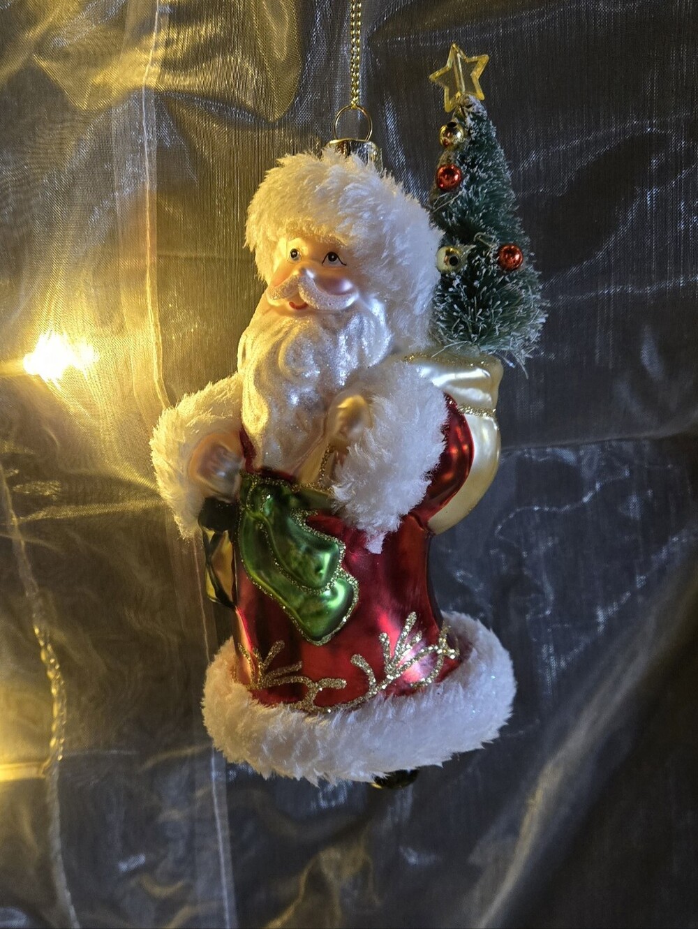 Festive Red Santa Ornament with Green Tree Accent